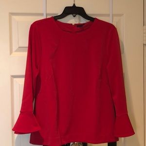 Red blouse with flare sleeves.